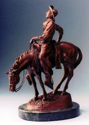 Rear view of "Longhorn Lullaby", a bronze by L.D. Edgar, Western Heritage Studio, Cody Wyoming